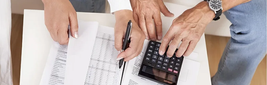 Family reviewing financial documents and insurance paperwork together