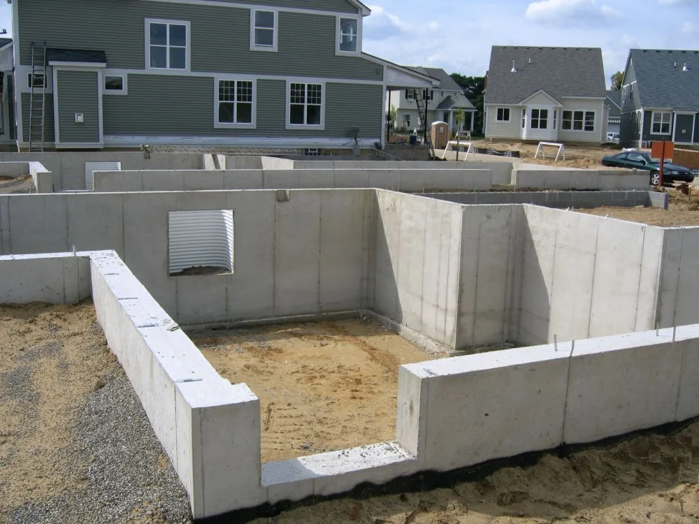 Concrete foundation being poured for a new residential build