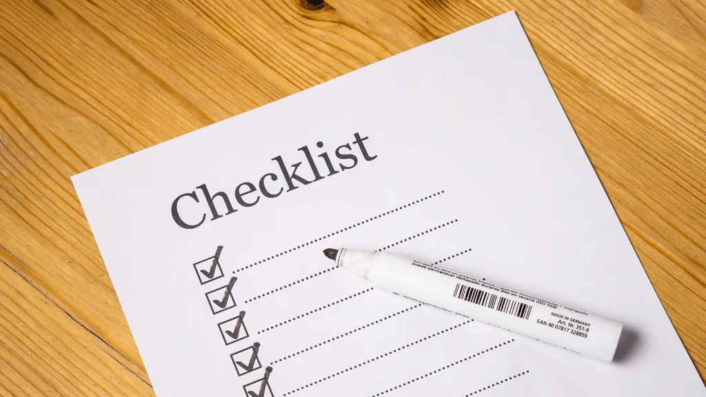 Financial planning checklist and pen