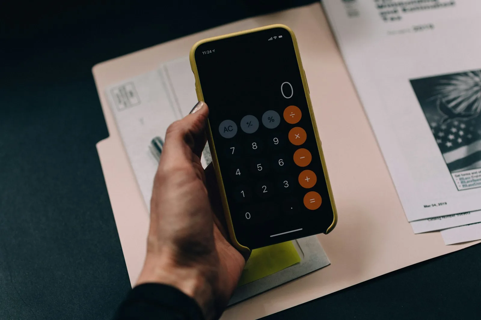 Calculator and financial paperwork used while paying down credit cards