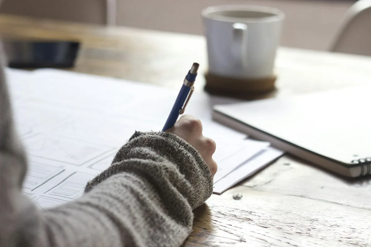 Notebook and pen for writing down CD maturity dates and ladder steps