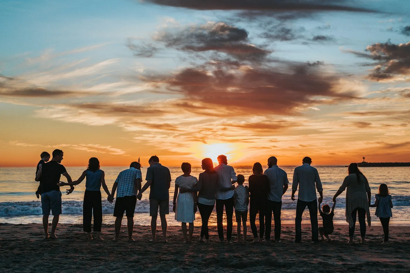 Family talking through household bills and a shared debt payoff plan