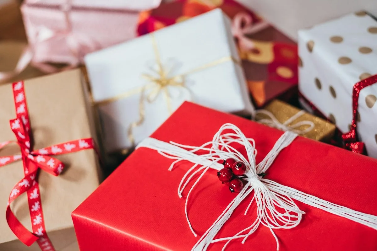 Wrapped gifts and shopping list for a holiday sinking fund