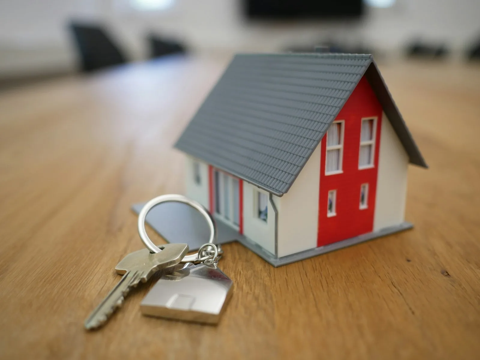House keys and a net-worth spreadsheet representing assets minus debts
