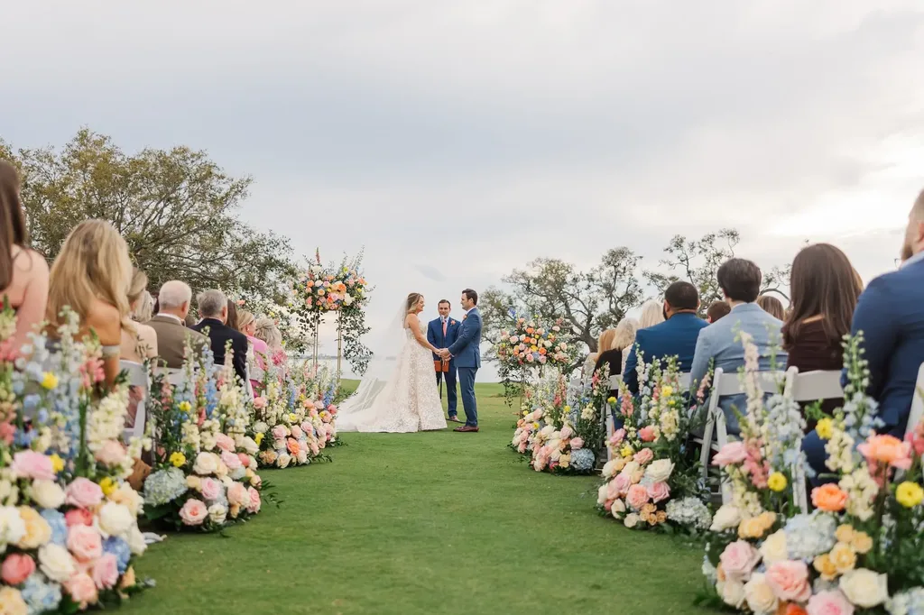 Outdoor garden wedding ceremony with guests